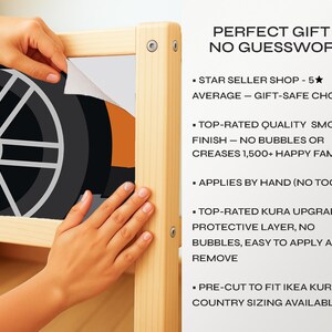 May include: A black and grey wheel design being applied to a wooden frame. The text reads "PERFECT GIFT - NO GUESSWORK" and lists features like a smooth finish and easy application. The design is pre-cut to fit IKEA KURA.
