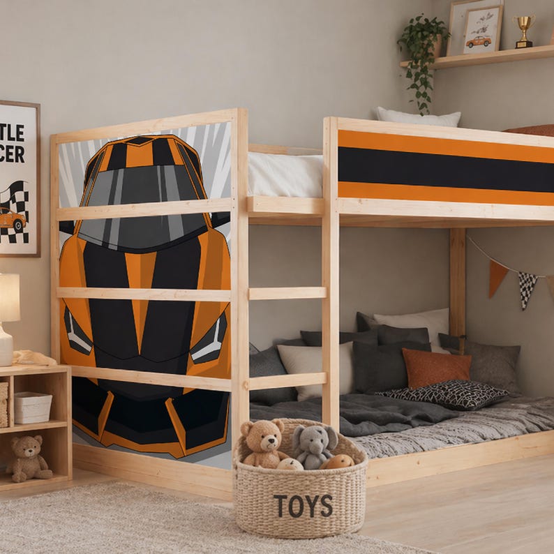 May include: Wooden bunk bed with an orange and black race car design. The bed has a natural wood finish and a lower level with a grey duvet and pillows. A woven basket labelled "TOYS" sits below.