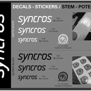 May include: A product display featuring Syncros decals and stickers. The image showcases various sizes and styles, including matte white and glossy black options. Measurements are provided in millimeters, with some decals measuring 88 x 23 mm.