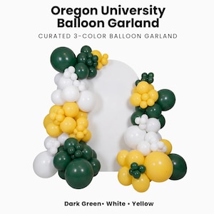 May include: A balloon garland featuring dark green, white, and yellow balloons arranged in clusters. The text reads Oregon University Balloon Garland, Curated 3-Color Balloon Garland, and Dark Green, White, Yellow.