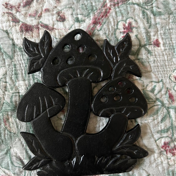 Vintage cast iron black mushroom footed trivet holder/wall decor