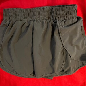 Lalala Short de sport pour femme, grande poche zippée pour clés, téléphone, carte de crédit