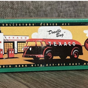 May include: A green box with a picture of a black and red Texaco truck with the words "Doodle Bug" and "Texaco 1934 Diamond Tanker" on it. The box says "Collector's Series #11 Locking Coin Bank with Key-Die-Cast Metal".