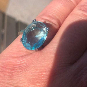 Princess Diana Meghan Markle aquamarine ring in oval setting.