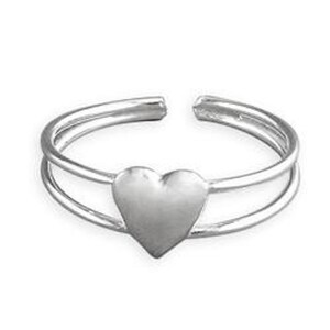May include: Silver adjustable ring with a heart-shaped design. The ring has a double band.