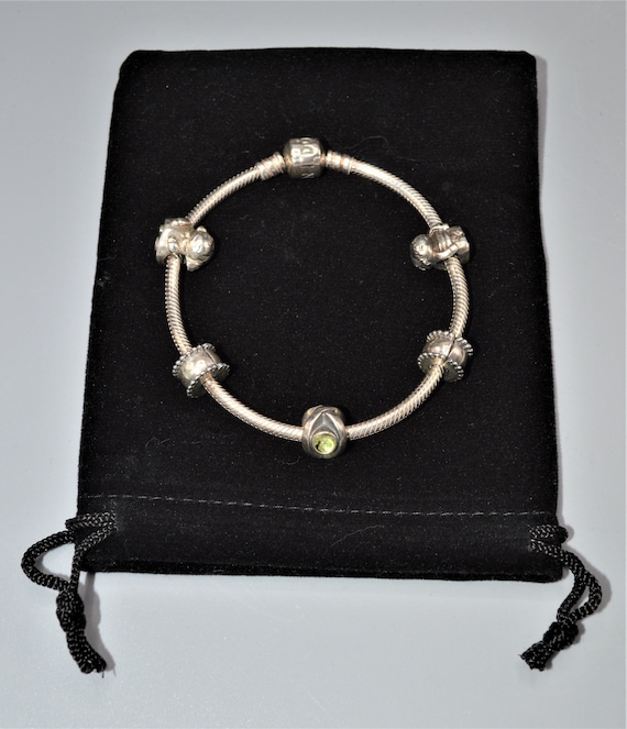 Pandora Bracelet with 3 Retired Charms-Boy, Girl,… - image 1