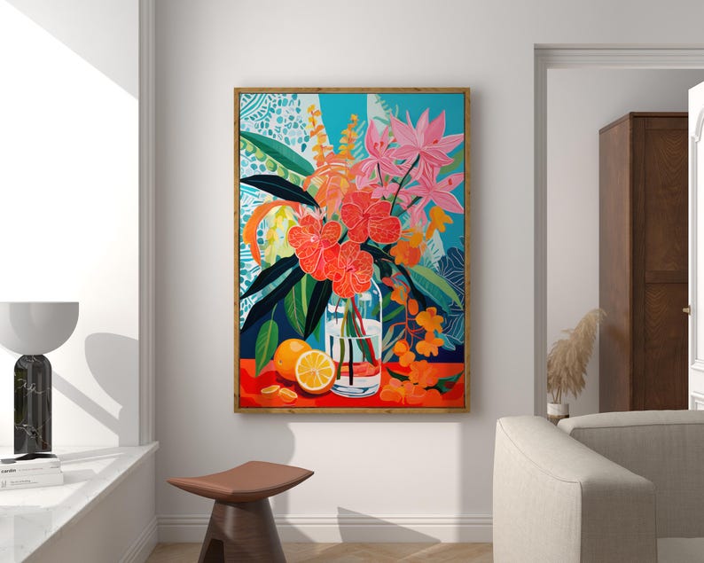 May include: A framed painting of a still life featuring a glass vase filled with pink and orange flowers, a sliced orange, and green leaves on a red background.