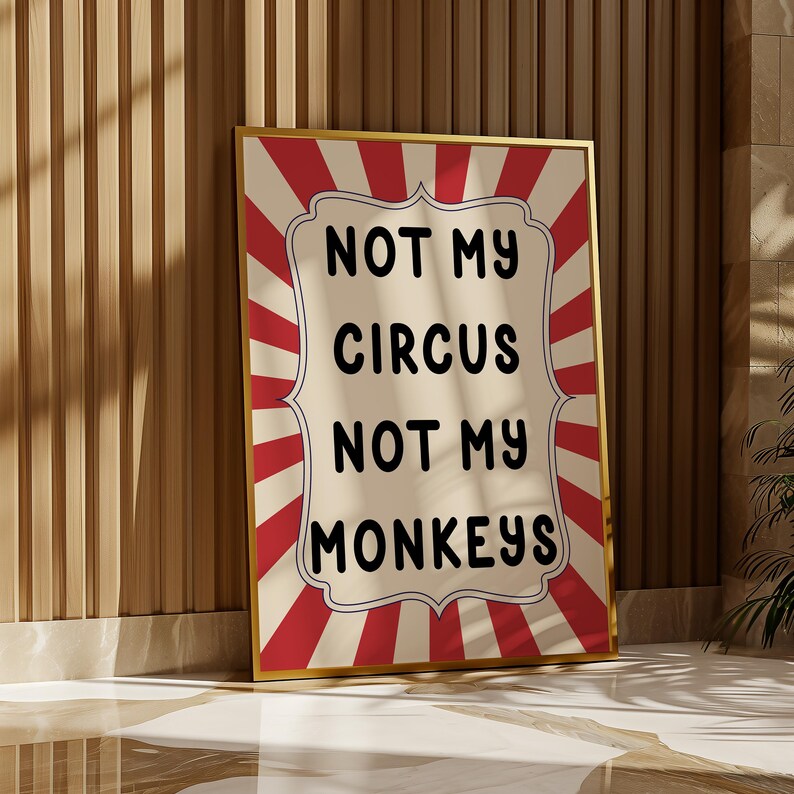 K&ouml;nnte beinhalten: Ein rot-wei&szlig; gestreiftes Poster mit dem Text "Not my circus, not my monkeys" in schwarzen Buchstaben.