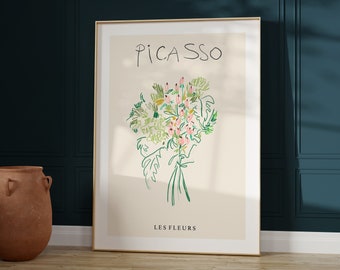 May include: A framed art print featuring a Picasso-style floral bouquet. The artwork showcases a cream-colored background with green, pink, and yellow flowers, and the word "PICASSO" at the top. The text "LES FLEURS" is at the bottom.