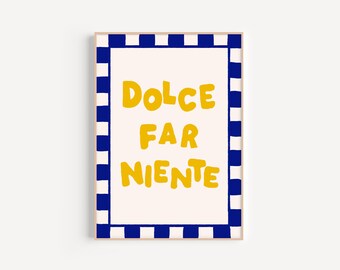 May include: A framed print with a white background and a blue and white checkered border. The text "DOLCE FAR NIENTE" is written in yellow.