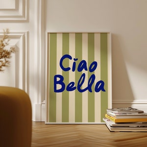 May include: A framed print with a green and white striped background and the text "Ciao Bella" in blue lettering.