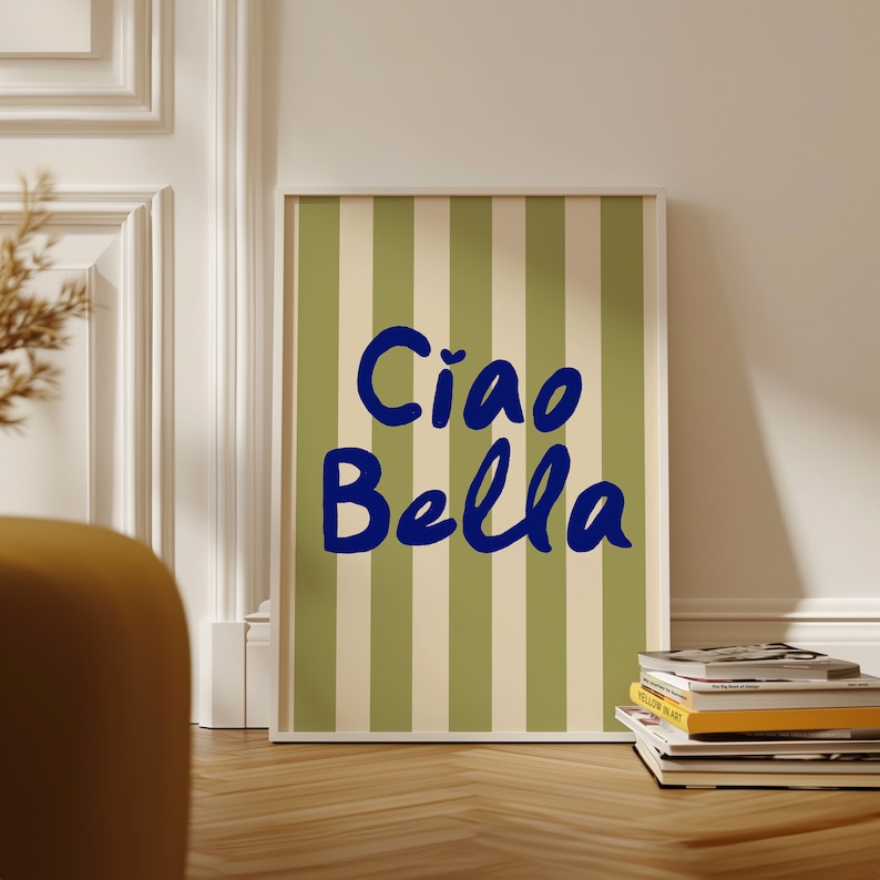 May include: A framed print with a green and white striped background and the text "Ciao Bella" in blue lettering.