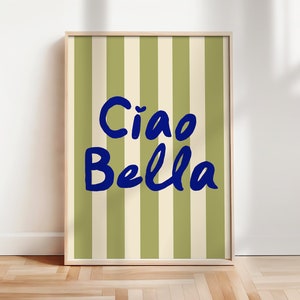 May include: A framed print with a green and white striped background and the text "Ciao Bella" in blue.