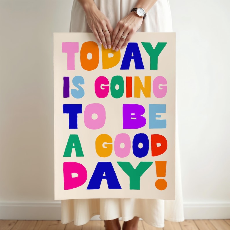 May include: A rectangular poster with the phrase "TODAY IS GOING TO BE A GOOD DAY!" in large, colorful, block letters. The letters are in shades of pink, orange, blue, green, and purple against a cream background.