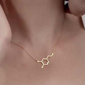Add a spark of science and style to your look with this elegant Sterling Silver Dopamine Necklace. Featuring a detailed dopamine molecule design, this necklace is perfect for science lovers, students, teachers, or anyone who appreciates the chemistry of motivation and happiness. Crafted in high-quality sterling silver, it makes a meaningful gift for graduation, birthdays, anniversaries, or just because.