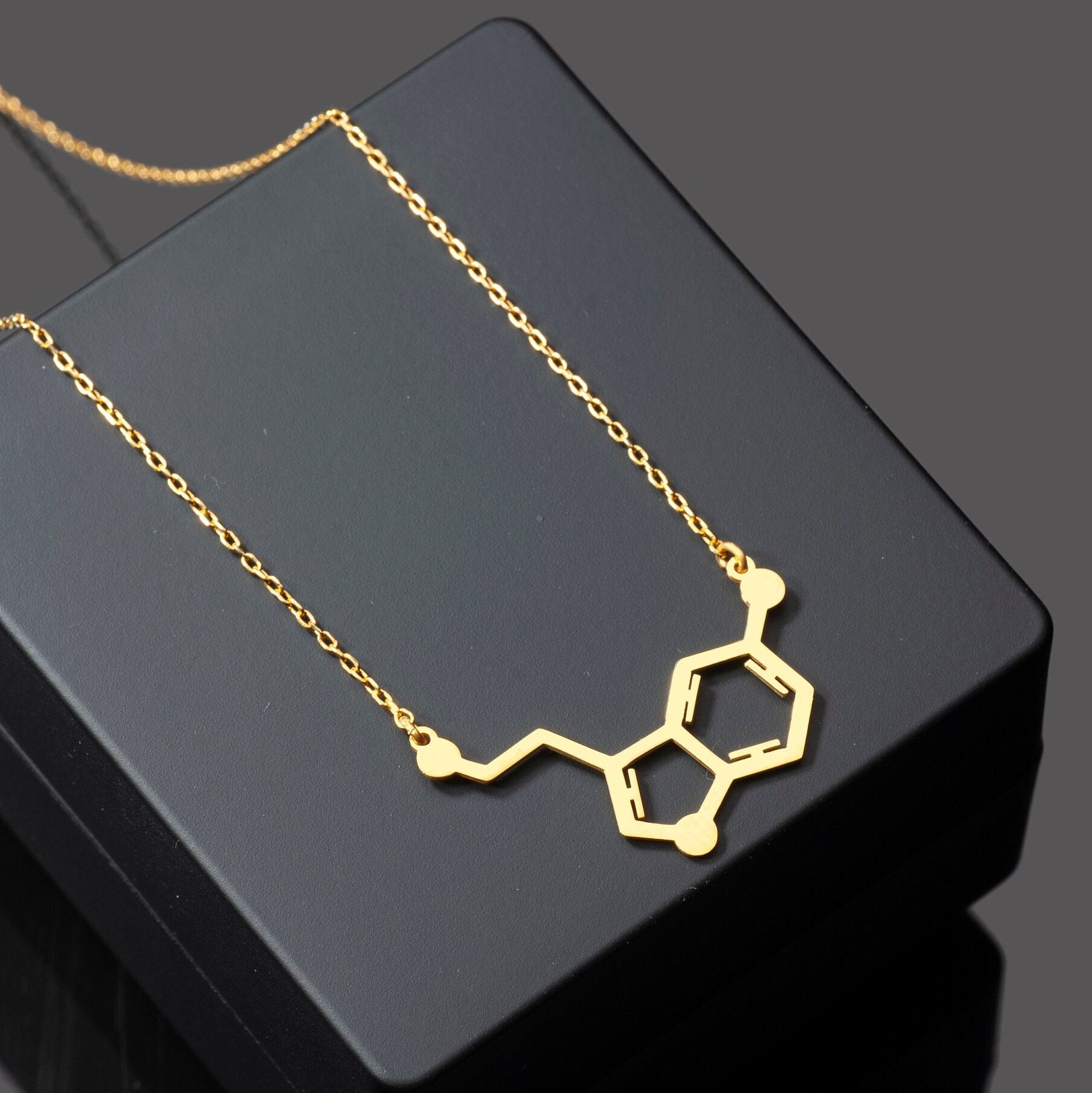 Theobromine molecule necklace in gold - Delftia science jewelry