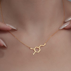 Add a spark of science and style to your look with this elegant Sterling Silver Dopamine Necklace. Featuring a detailed dopamine molecule design, this necklace is perfect for science lovers, students, teachers, or anyone who appreciates the chemistry of motivation and happiness. Crafted in high-quality sterling silver, it makes a meaningful gift for graduation, birthdays, anniversaries, or just because.