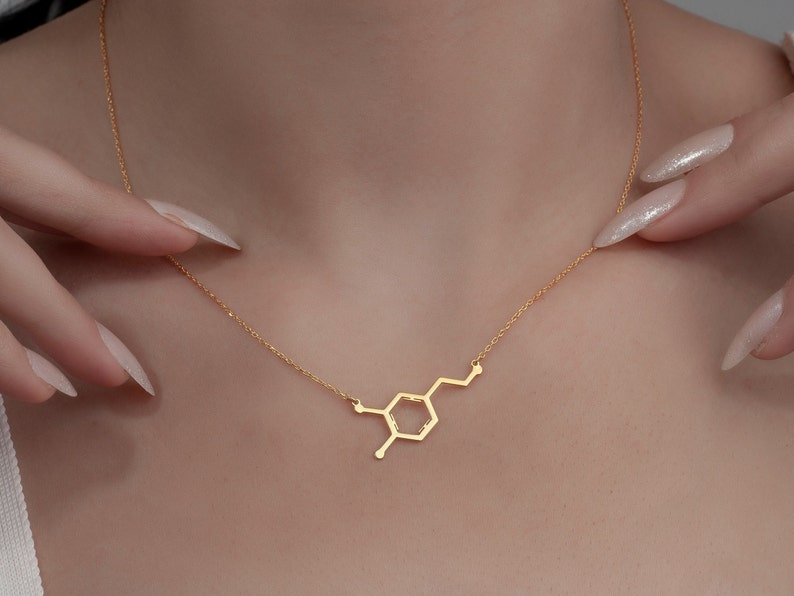 Add a spark of science and style to your look with this elegant Sterling Silver Dopamine Necklace. Featuring a detailed dopamine molecule design, this necklace is perfect for science lovers, students, teachers, or anyone who appreciates the chemistry of motivation and happiness. Crafted in high-quality sterling silver, it makes a meaningful gift for graduation, birthdays, anniversaries, or just because.