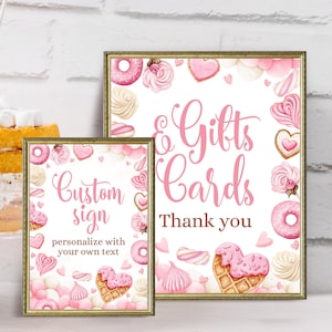 May include: Two printable signs with a pink and white watercolor design featuring donuts, hearts, and other sweet treats. The text on the signs reads "Custom sign personalize with your own text" and "Gifts & Cards Thank you".