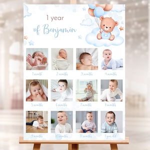 May include: A blue and white baby milestone poster with a teddy bear holding balloons. The poster has 12 photo spaces for each month of the baby's first year. The text on the poster reads "1 year of Benjamin".