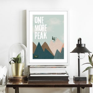 May include: A minimalist poster with a mountain range and a silhouette of a person riding a bicycle. The text "ONE MORE PEAK" is printed in white on a light blue background.