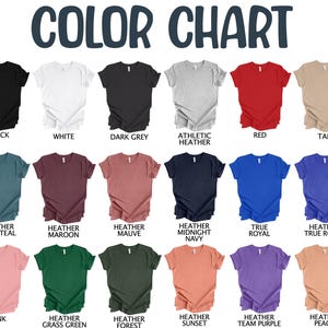 May include: A color chart displaying various t-shirt colors, including black, white, dark grey, red, and tan. Additional colors are heather deep teal, heather maroon, heather mauve, heather midnight navy, true royal, and heather true royal. The chart also shows pink, heather grass green, heather forest, heather sunset, heather team purple, and heather peach.