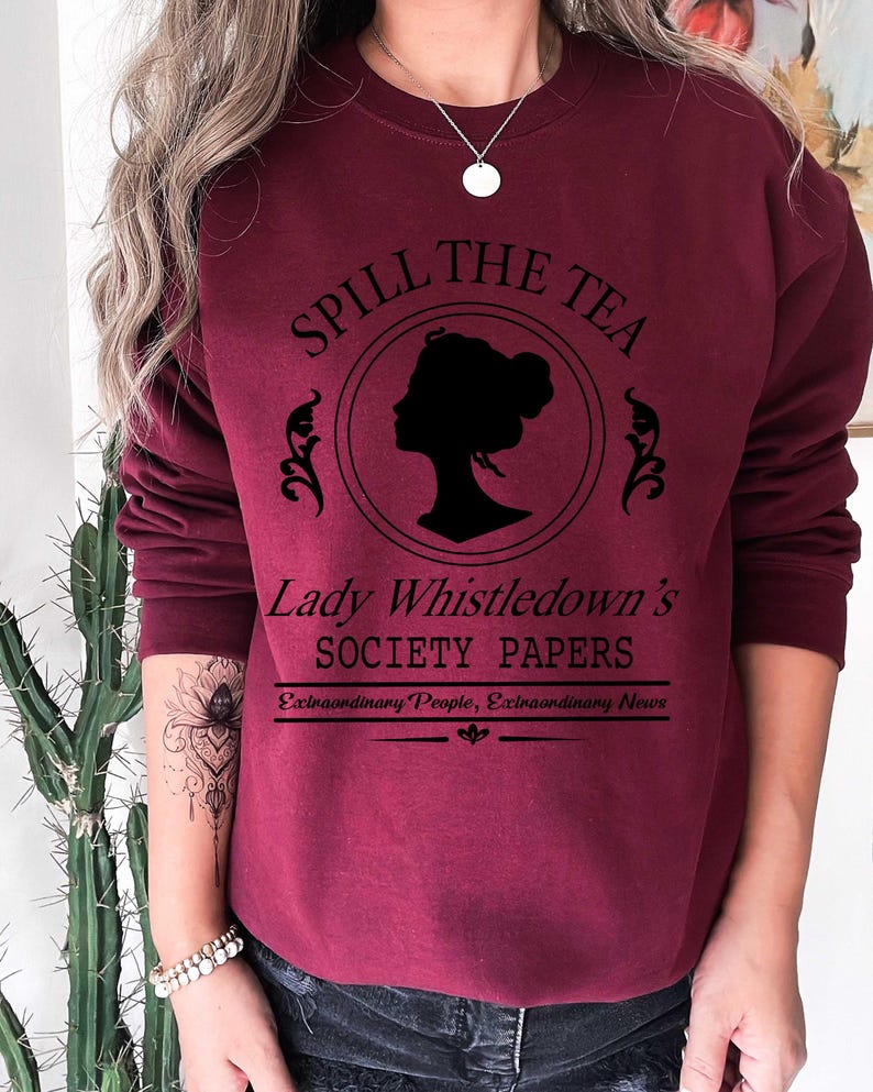 May include: Burgundy sweatshirt with the text "Spill the Tea" above a silhouette of a woman's profile in a circle. Below the circle is "Lady Whistledown's Society Papers" and "Extraordinary People, Extraordinary News".