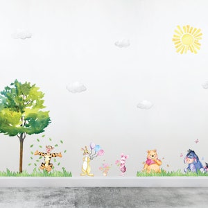 May include: A watercolor-style wall decal set featuring Winnie the Pooh and his friends. The set includes a tree, a sun, clouds, and characters like Tigger, Piglet, and Eeyore.