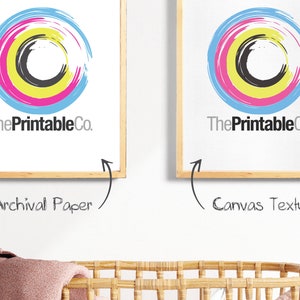 May include: Two framed prints of a colorful circle design with the text "ThePrintableCo." printed below. The print on the left is on archival paper and the print on the right is on canvas texture.