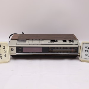 Vintage radio alarm clock and two electric clocks