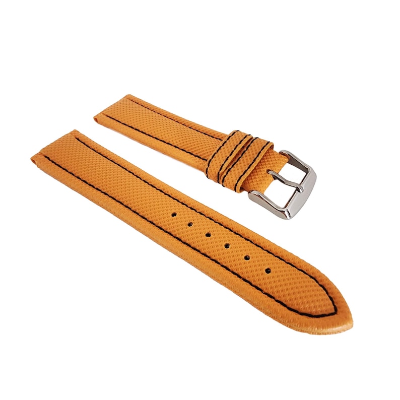 May include: A pair of orange watch straps with black stitching and a silver buckle. The straps have a textured surface and are designed to attach to a watch case. The watch straps are new.
