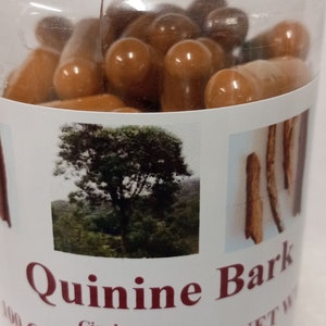 May include: A clear plastic bottle filled with brown capsules. The label reads "Quinine Bark Cinchona 100 Capsules 600 mg NET W".