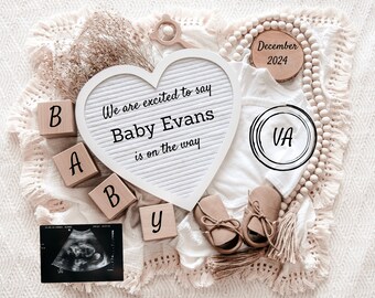 May include: A white heart-shaped letter board with the text "We are excited to say Baby Evans is on the way".  The board is surrounded by wooden blocks spelling "BABY", a white onesie, brown baby shoes, a wooden bead garland, a wooden sign with the text "December 2024", and a black and white ultrasound image.
