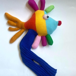 May include: A white ceramic mug with a black handle and the text "But First, Coffee" in a bold, black font. The mug sits on a white surface, showcasing its clean design.