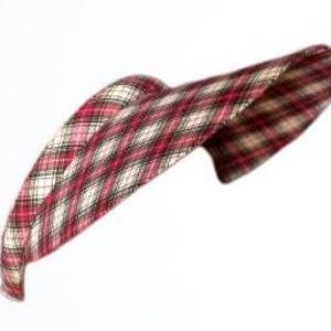 May include: A red and white plaid sun visor with a curved brim.