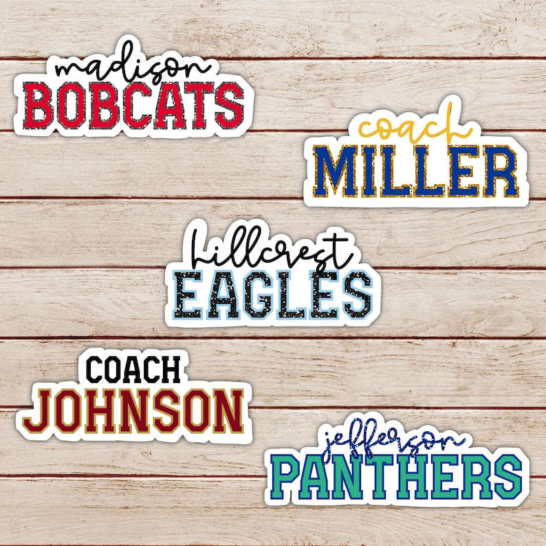 May include: Five different school team name and coach name stickers. The stickers are white with black, red, blue, gold, and green lettering. The names include Madison Bobcats, Coach Miller, Hillcrest Eagles, Coach Johnson, and Jefferson Panthers.
