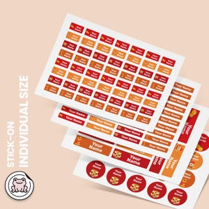 May include: A collection of rectangular and circular adhesive labels featuring red and orange backgrounds with the text Your Name and small graphic illustrations of lion dance masks and peanuts, arranged on multiple white sticker sheets.