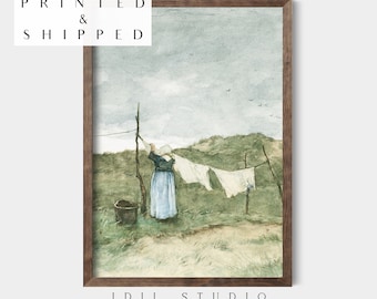 May include: A watercolor painting of a woman hanging laundry on a clothesline in a field. The woman is wearing a blue dress and a white apron. The sky is cloudy and there are birds flying in the distance.