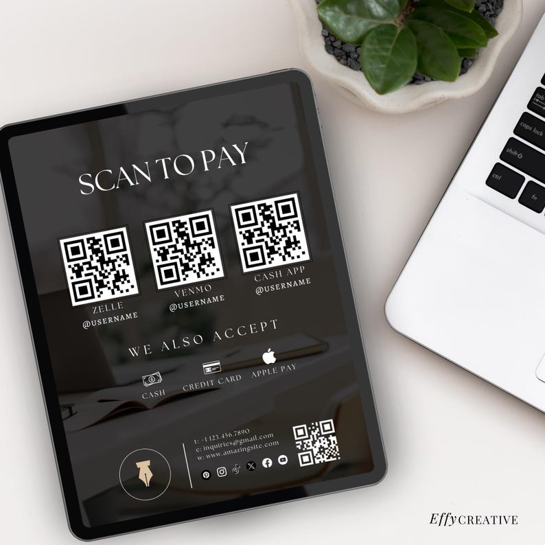 May include: A digital tablet displays a payment screen with the text "SCAN TO PAY." It features QR codes for Zelle, Venmo, and Cash App, along with payment options. The tablet is next to a laptop and a small plant.