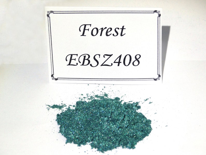 May include: A small pile of green glitter pigment with a white label that reads "Forest EBSZ408".
