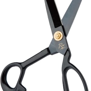 May include: Black scissors with a gold-colored rivet and the letter "R" etched on the blade. The handles have a loop design. The blades are open, and the scissors are set against a white background.