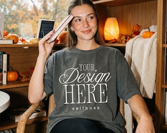 May include: A charcoal gray short-sleeve t-shirt featuring the white text "YOUR Design HERE" in a mix of script and serif fonts, with the word "selfboss" printed in smaller lowercase letters underneath the main graphic design.