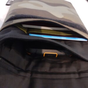 One of the two padded pockets has a slot for a credit card and a little slot for maybe a lip balm or a couple of coins.