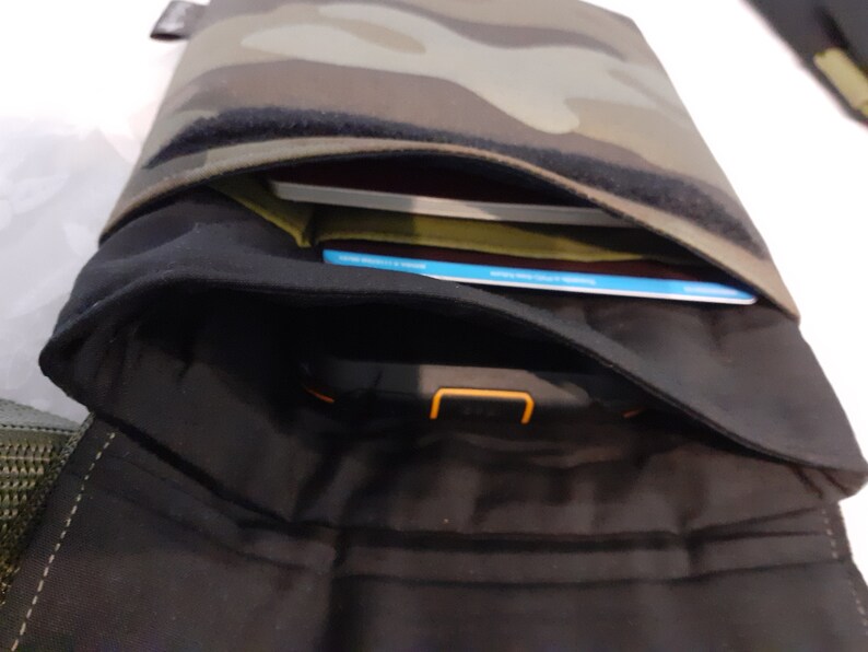 One of the two padded pockets has a slot for a credit card and a little slot for maybe a lip balm or a couple of coins.