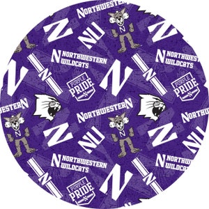 May include: Circular purple fabric featuring a repeating pattern of Northwestern Wildcats logos, the letter "N", and the words "Northwestern Wildcats" and "Purple Pride". The design includes a cartoon Wildcat mascot.