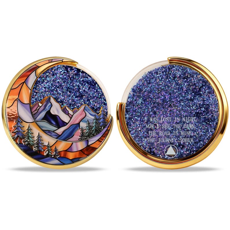 May include: Two-sided, gold-rimmed coin with a stained-glass mountain and moon design. The other side has glitter and text that reads "WAS LOST IN NIGHT, NOW I SEE THE DAWN, THE ROAD IS MINE, THE JOURNEY SOBER."