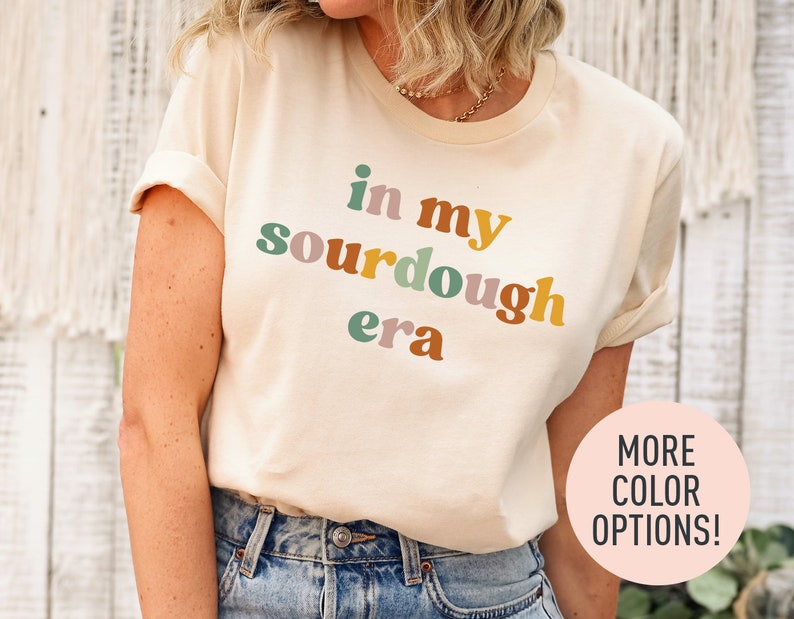a woman wearing a t - shirt that says in my sourdough era