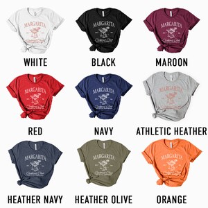 a group of different colored shirts with names on them
