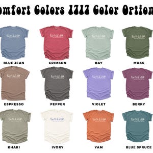 a collection of t-shirts in various colors, including blue, red, green, brown, black, gray, beige, peach, and blue.