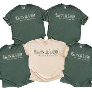 five green t-shirts with a similar design, arranged in a row.